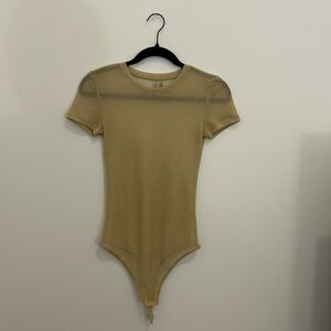 Gold sheer shimmer bodysuit from Anthropologie